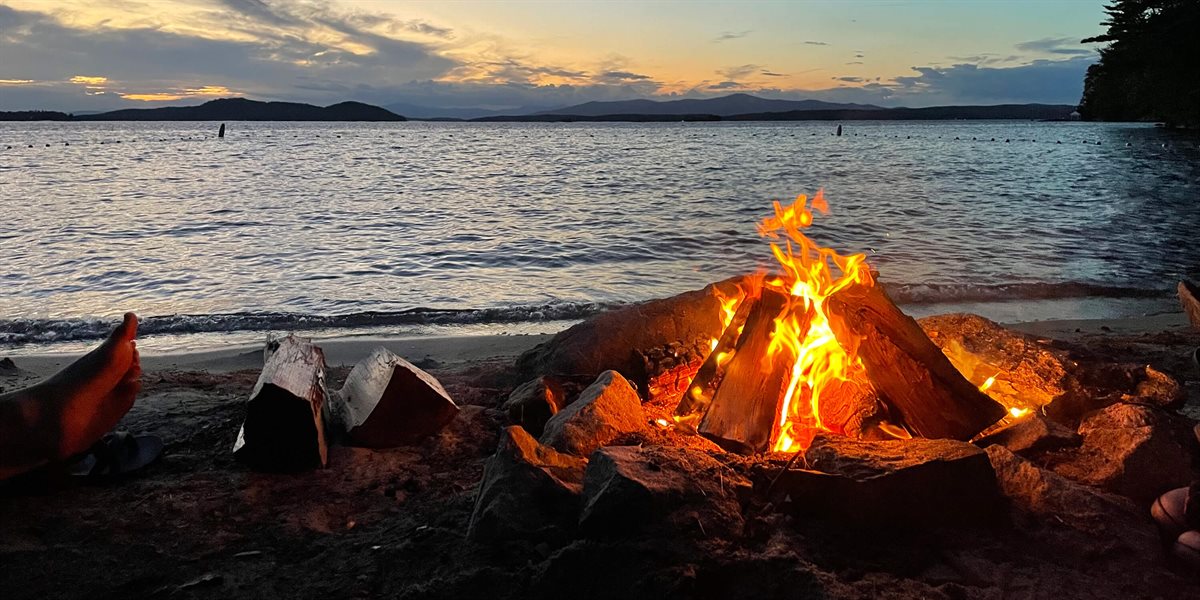 Bonfire at sunset on Lake Winnipesaukee