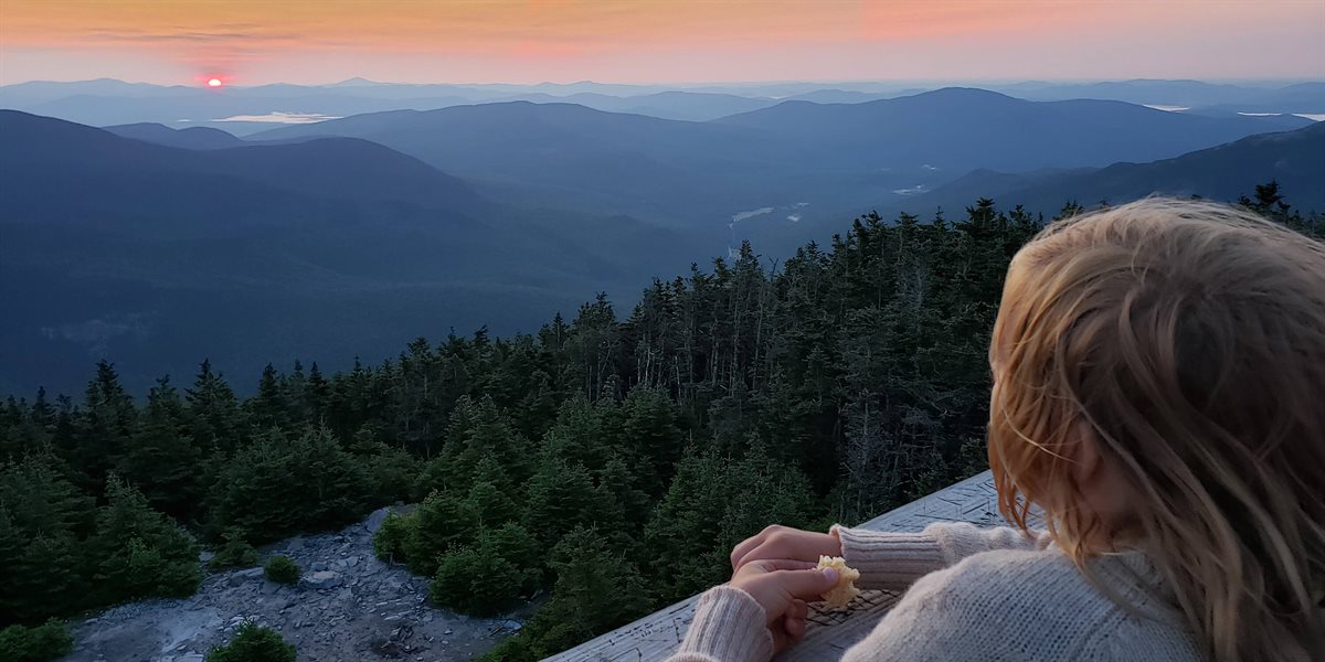 Camper looking over mountain valley