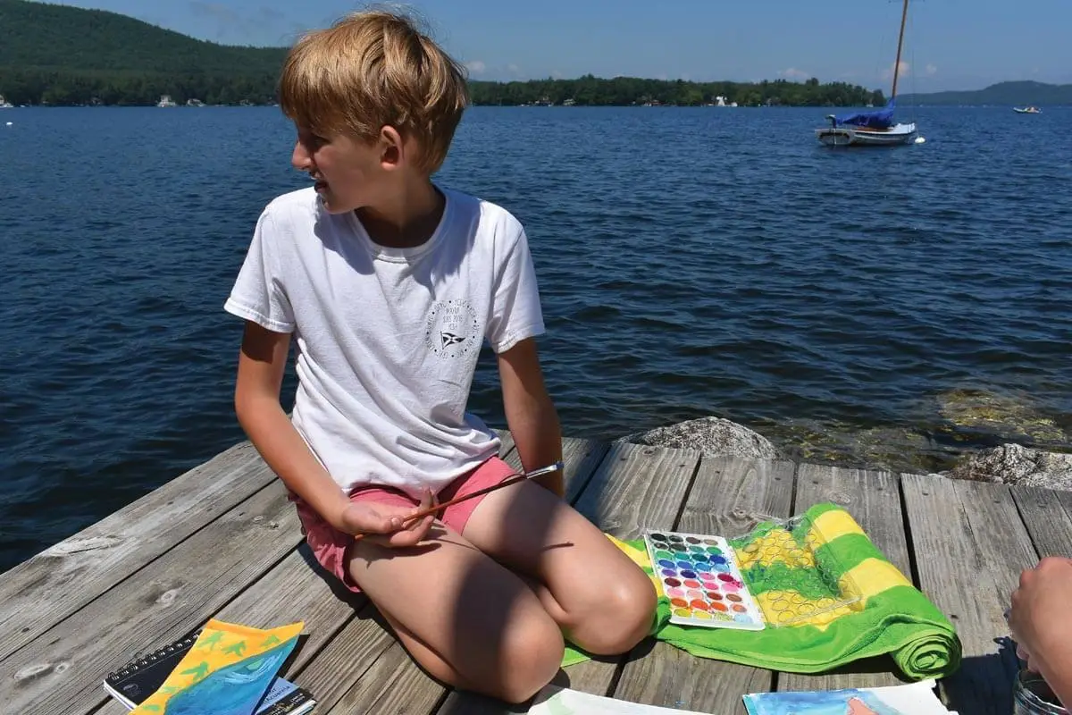 Boy participating in arts and crafts at Kabeyun 