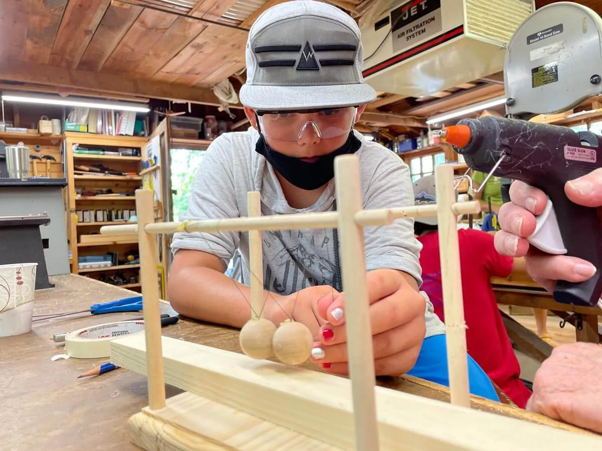 Boy working in the woodshop 