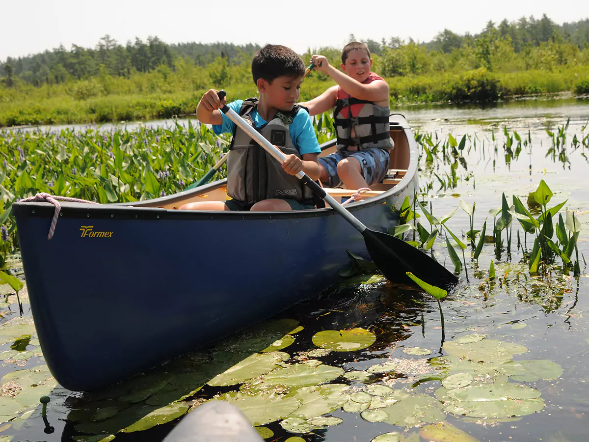 Boys canoeing on Lake Winnipesaukee