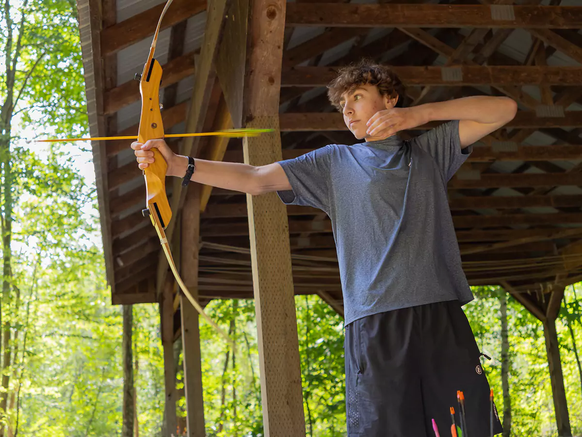 Boy learning archery
