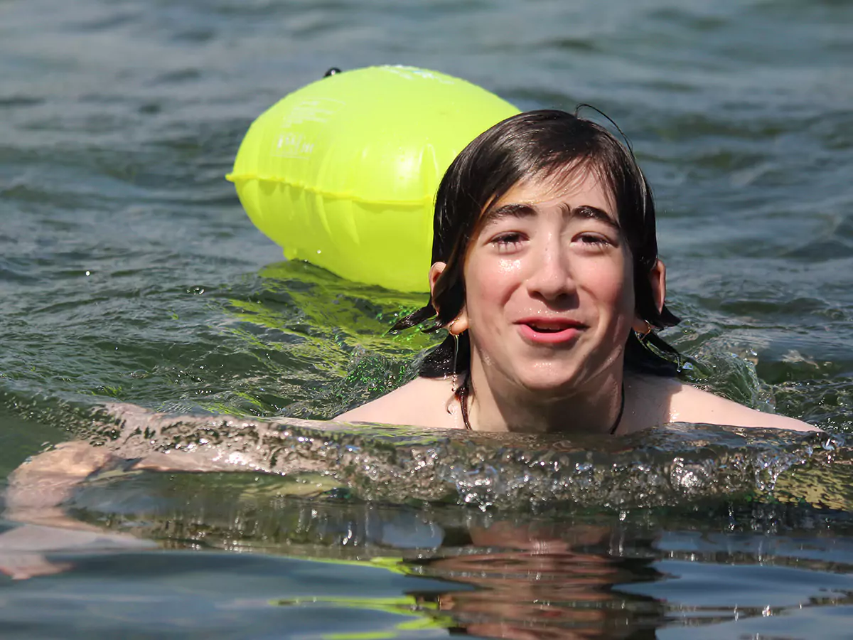 Two boys swimming in Lake Winnipesaukee