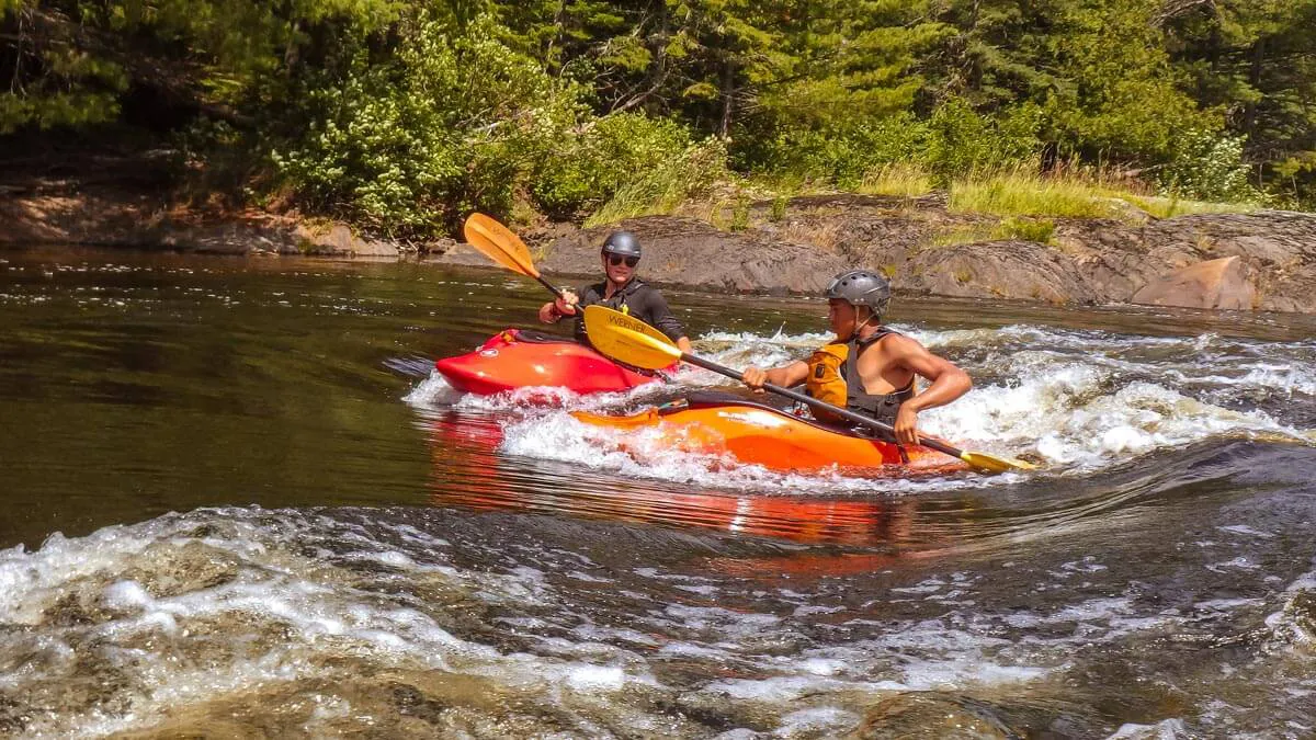 Boys learning to kayak 