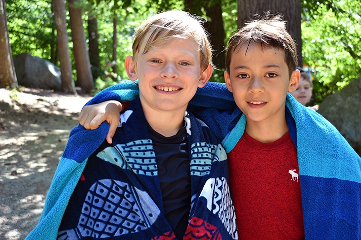 Boys smiling after playing on Lake Winnipesaukee