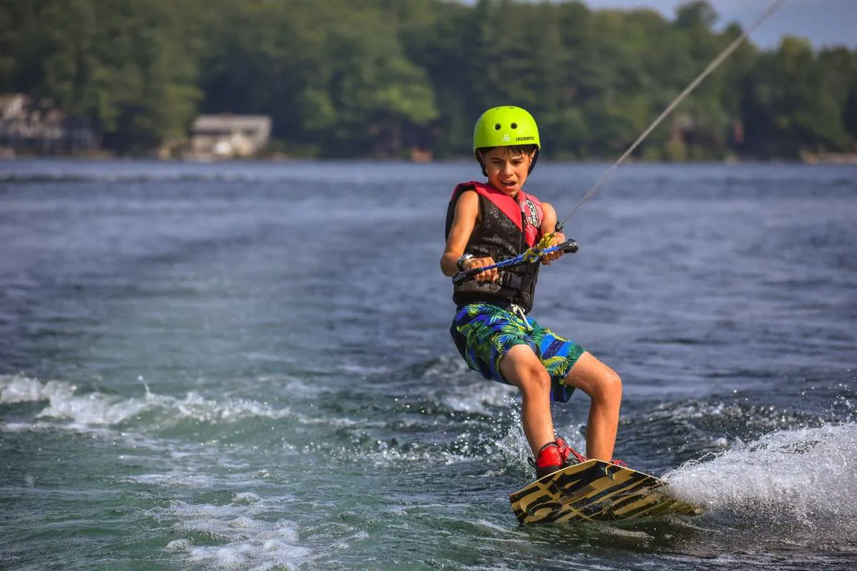 Boy wakeboarding on Lake Winnipesaukee